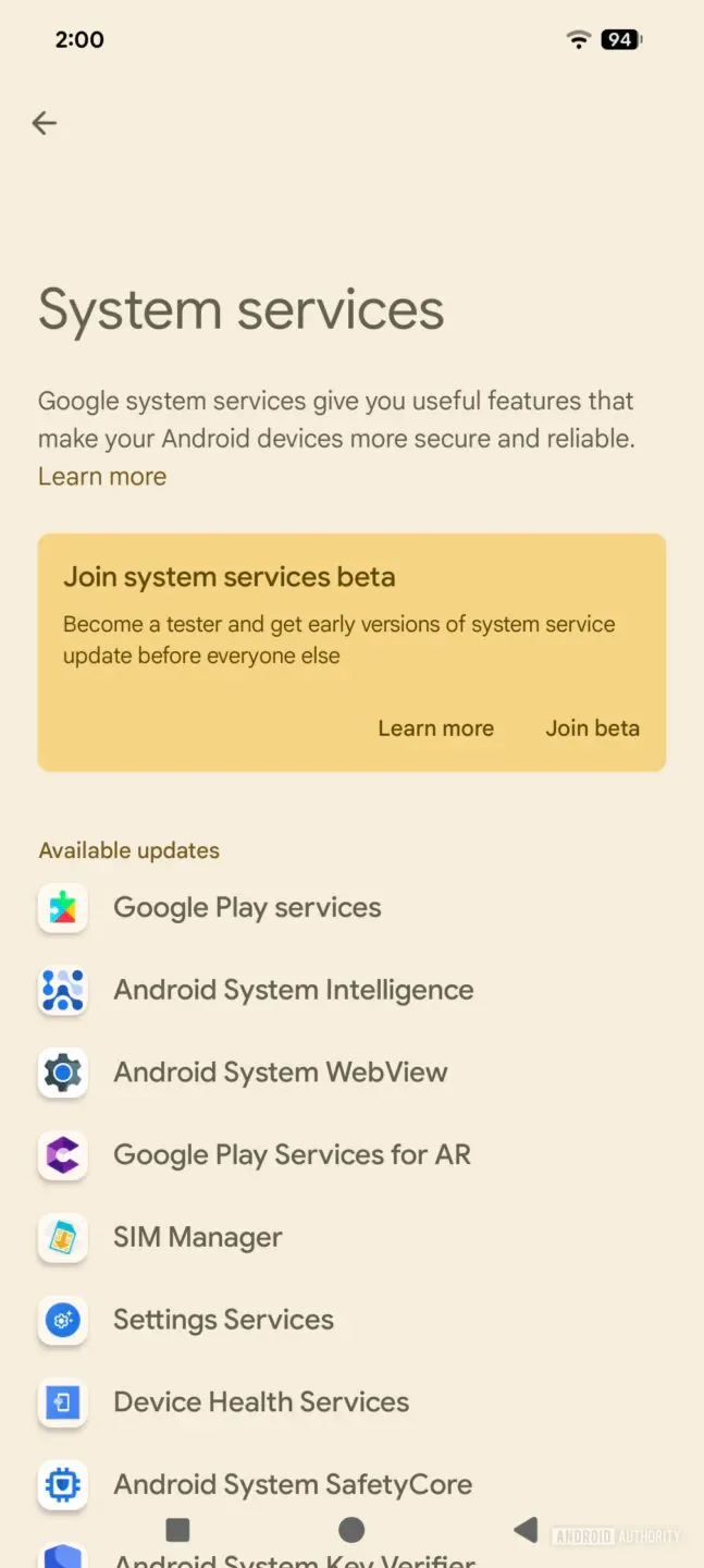 System services screen with a beige background, introductory text, and a yellow card inviting users to join the beta program, plus a list of available updates like Google Play services and Android System Intelligence