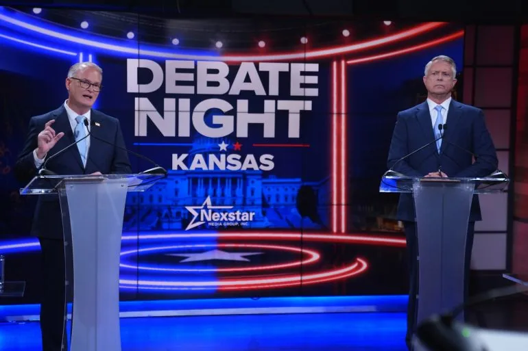 Republican Senator Roger Marshall, right, and Democratic nominee for US Senate Adam Hamilton participate in a debate at WDAF TV in Kansas City